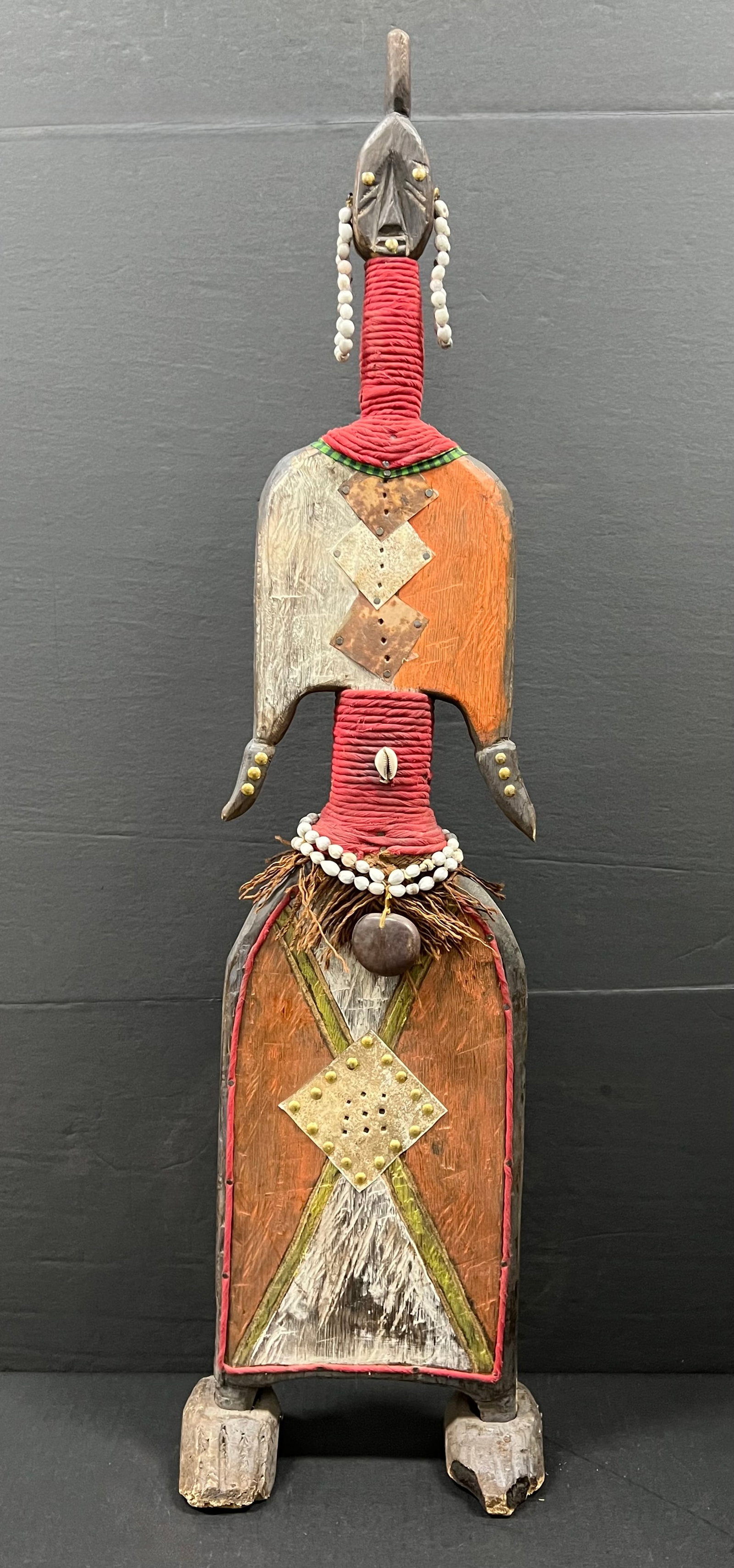 Carved Wood Large Namji Doll: African Tribal Art Carved Wood Large Namji Doll. The dimension is 35.5 inches high x 8 inches wide. Please be aware that some of the items are vintage, secondhand, old ages, antiques and may have a de
