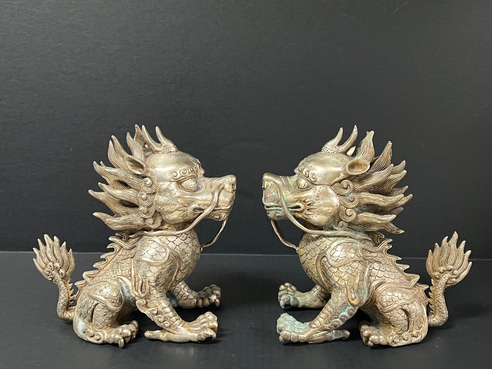 Pair of Silver Gilt Bronze Feng Shui Qilin Dog Sculpture: Chinese Art Pair of Silver Gilt Bronze feng Shui Qilin Dog Sculpture. The dimension is 9 inches high x 8 inches wide. Please be aware that some of the items are vintage, secondhand, old ages, antiques