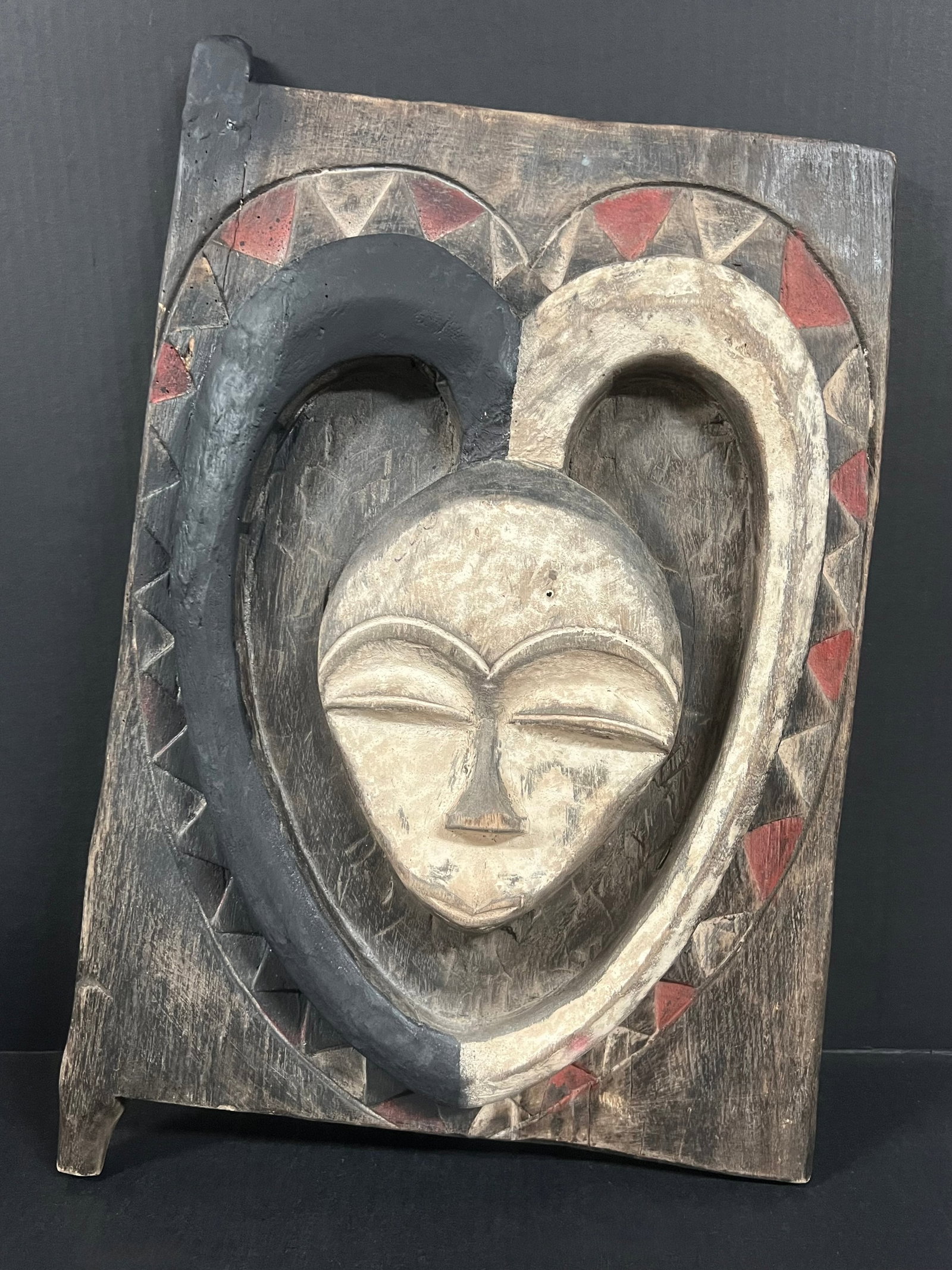 Carved Wood Kwele Door: African Tribal Art Carved Wood Kwele Mask. The dimension is 21.5 inches high x 13.5 inches wide. Please be aware that some of the items are vintage, secondhand, old ages, antiques and may have a defec