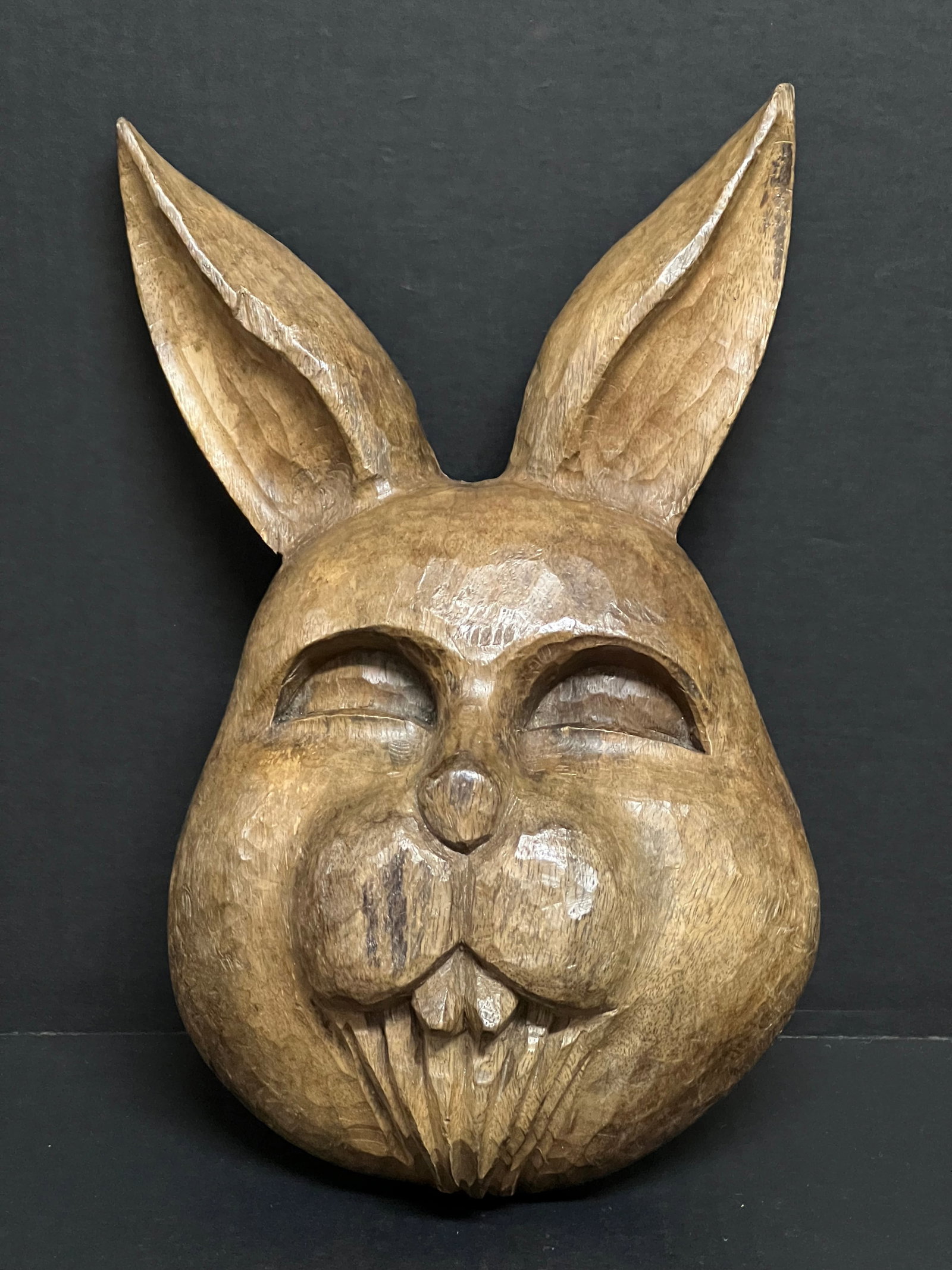 Carved Wood Rabbit Face: Folk Art Carved Wood Rabbit Face. The dimension is 12 inches high x 7 inches wide. Please be aware that some of the items are vintage, secondhand, old ages, antiques and may have a defects or sign of 