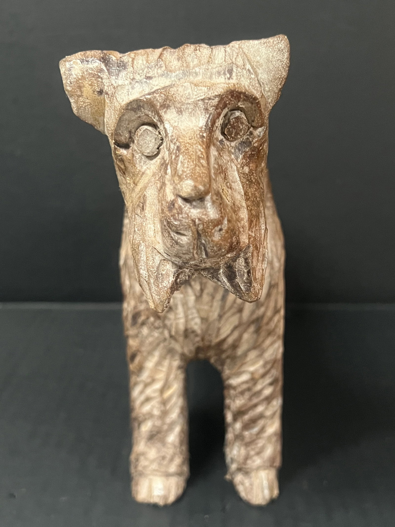 Carved Wood Dog Sculpture: Folk Art Carved Wood Dog Sculpture. The dimension is 8.5 inches high x 12.5 inches wide. Please be aware that some of the items are vintage, secondhand, old ages, antiques and may have a defects or si