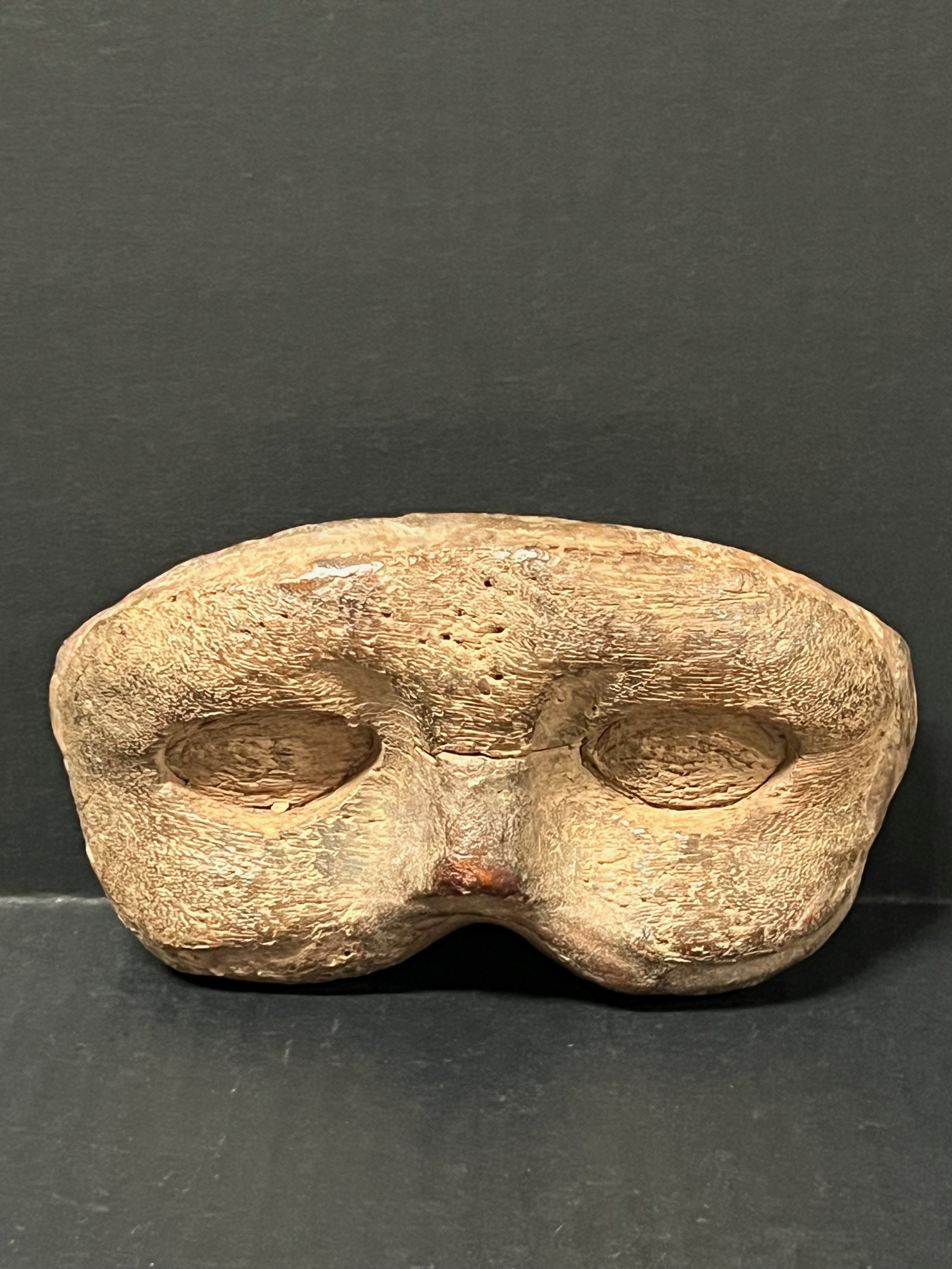 Carved Wood Mask: Folk Art Carved Wood Mask. The dimension is 3 inches high x 6.5 inches wide. Please be aware that some of the items are vintage, secondhand, old ages, antiques and may have a defects or sign of ages, 