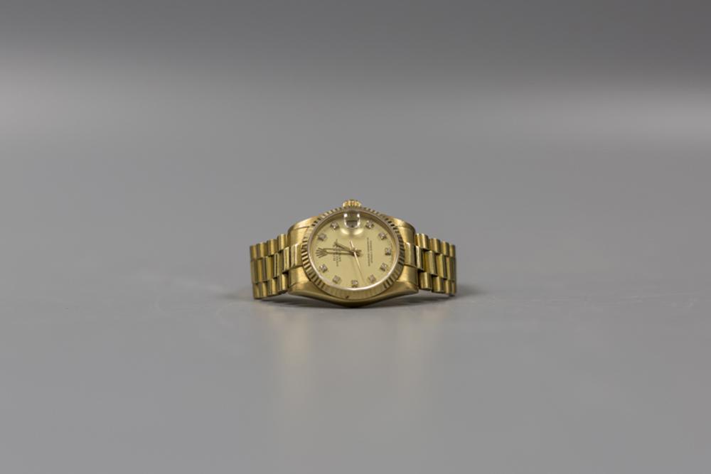 A ROLEX WATCH: Notice to bidders: Condition reports and additional photographs are available by request. The absence of a condition report does not imply that the lot is in perfect condition.