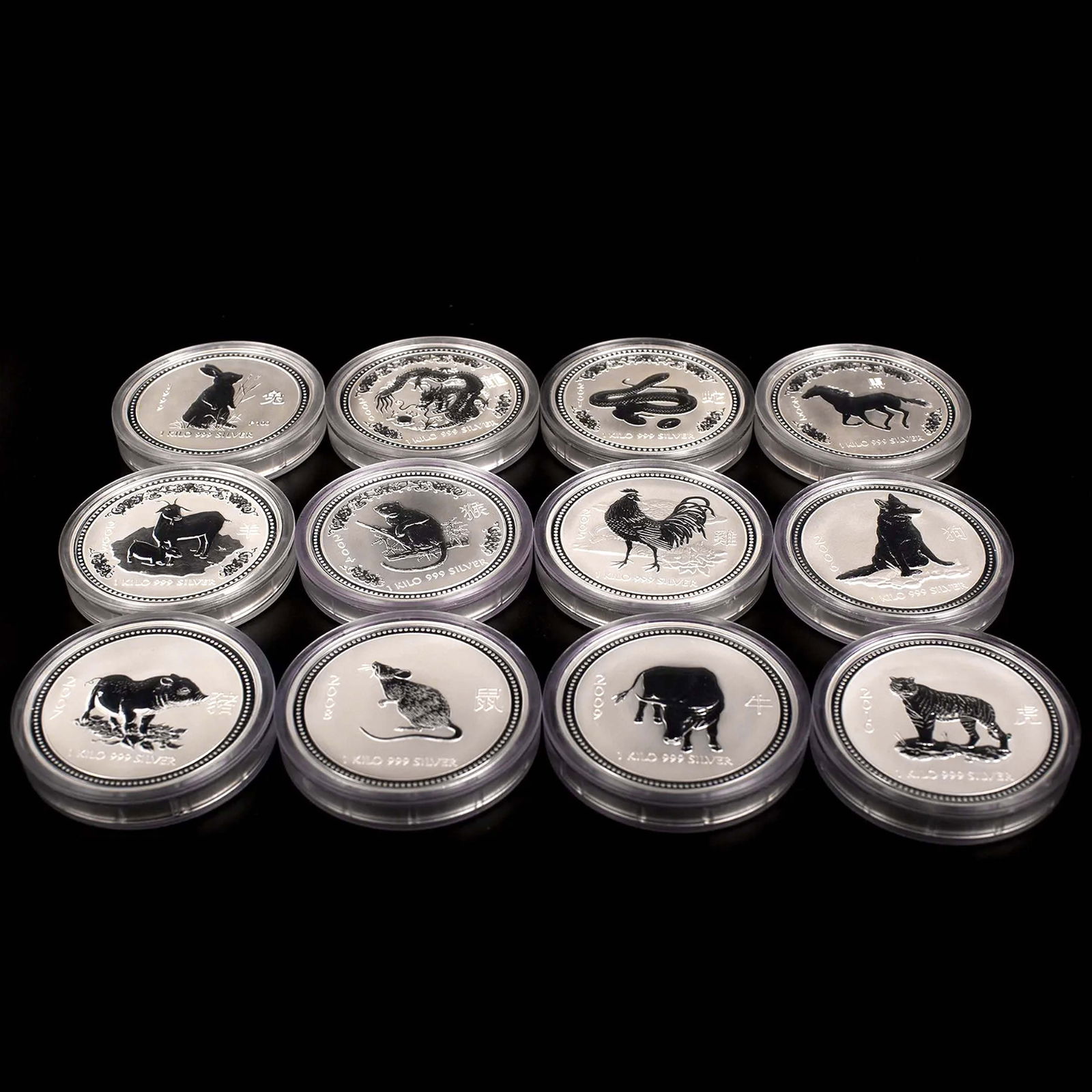 A SET OF 12 AUSTRALIA ELIZABETH II 30 DOLLARS CHINESE ZODIAC SILVER COINS-LIMITED EDITION, FROM YEAR: Diameter: 11cm. A set of 12 1 kilo 999 silver coins, from the year of 1999(Rabbit), 2000(Dragon), 2001(Snake), 2002(Horse), 2003(Goat), 2004(Monkey), 2005(Rooster), 2006(Dog), 2007(Pig), 2008(Rat), 20