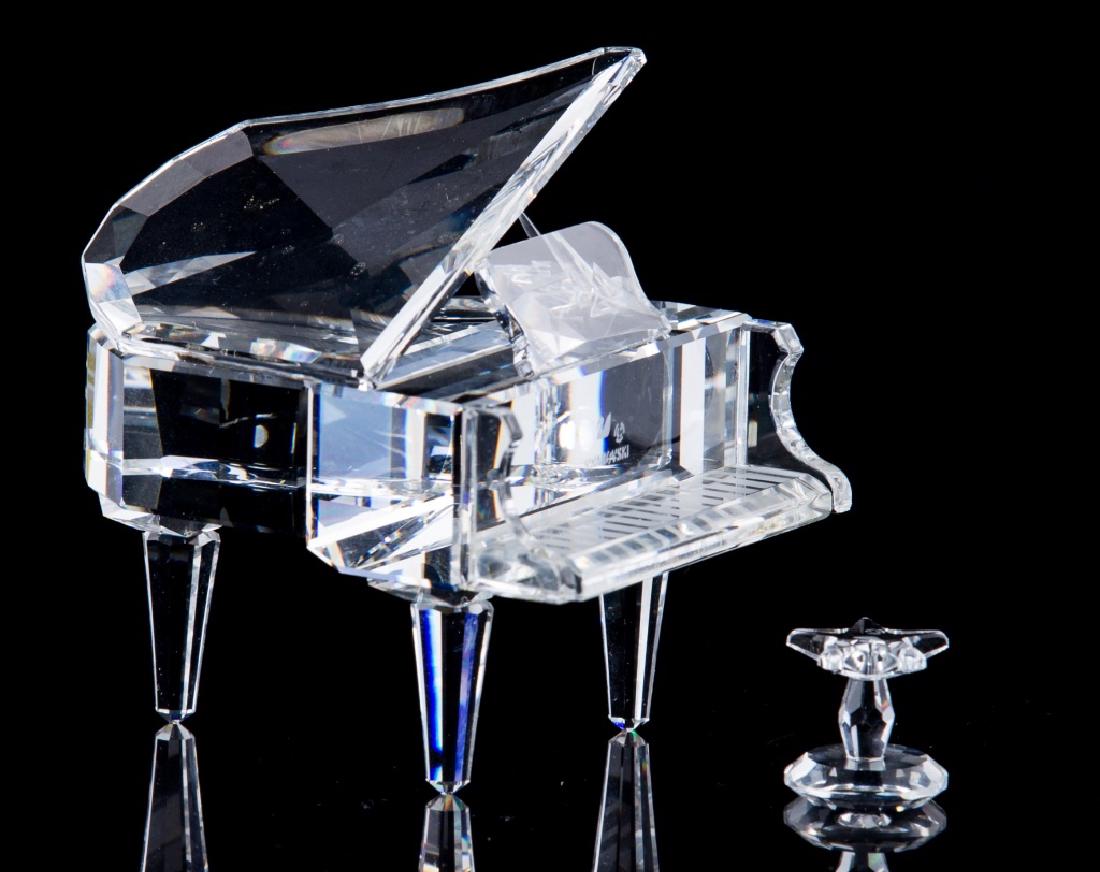 SWAROVSKI CRYSTAL FIGURINE: Swarvoski piano with stool crystal figurines. Largest measures 21/2" height and width.