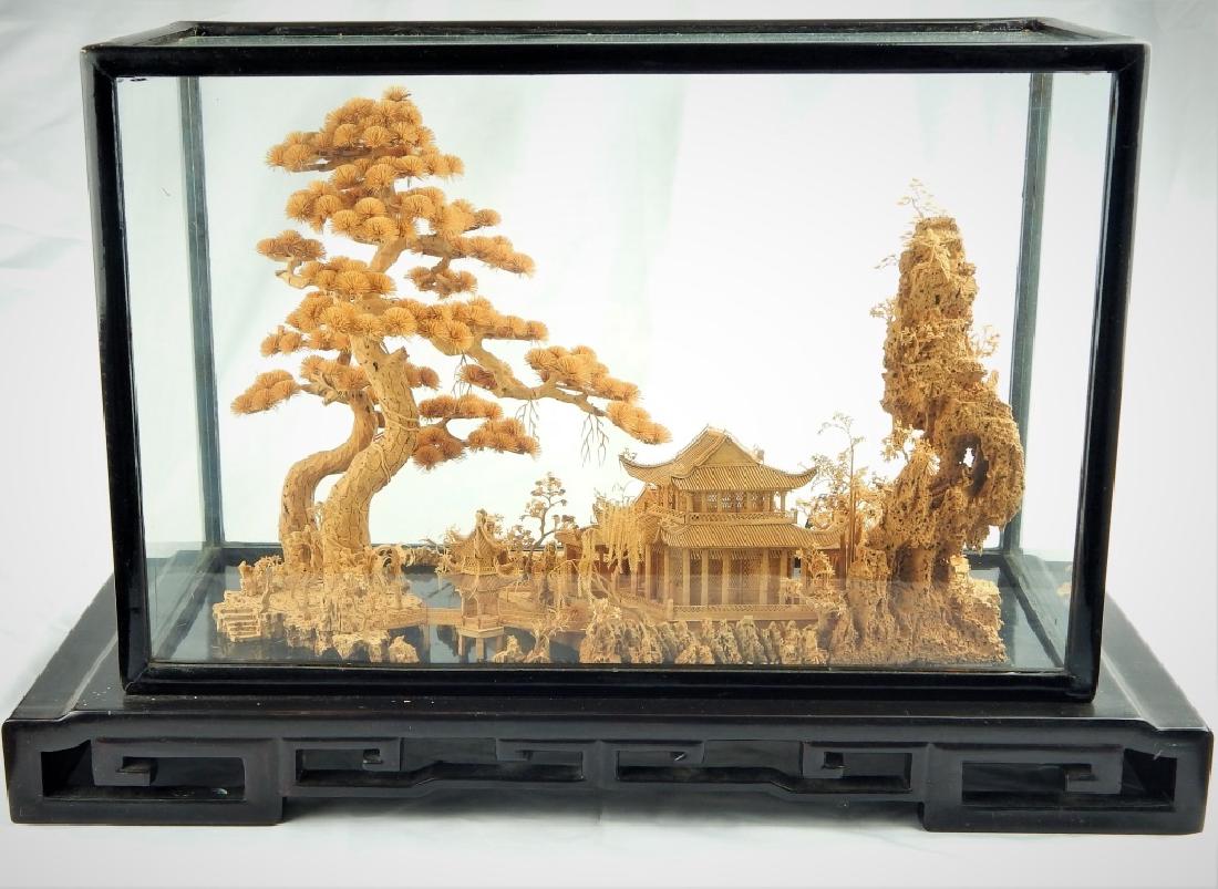 LARGE CHINESE CARVED CORK ENCASED LANDSCAPE: Large and very detailed Chinese carved cork encased landscape. Measures 22" width by 13" height including base and case.
