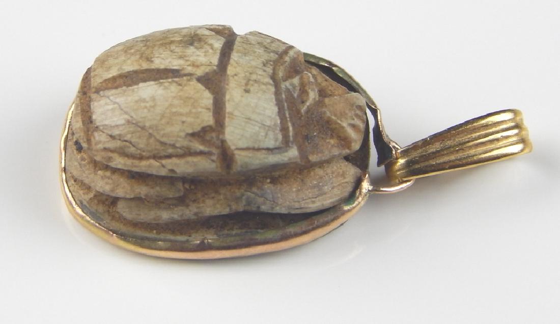 ANCIENT EGYPTIAN SCARAB SEAL AND GOLD PENDANT: Ancient Egyptian Scarab Seal and gold pendant. Measures 5/8" length.