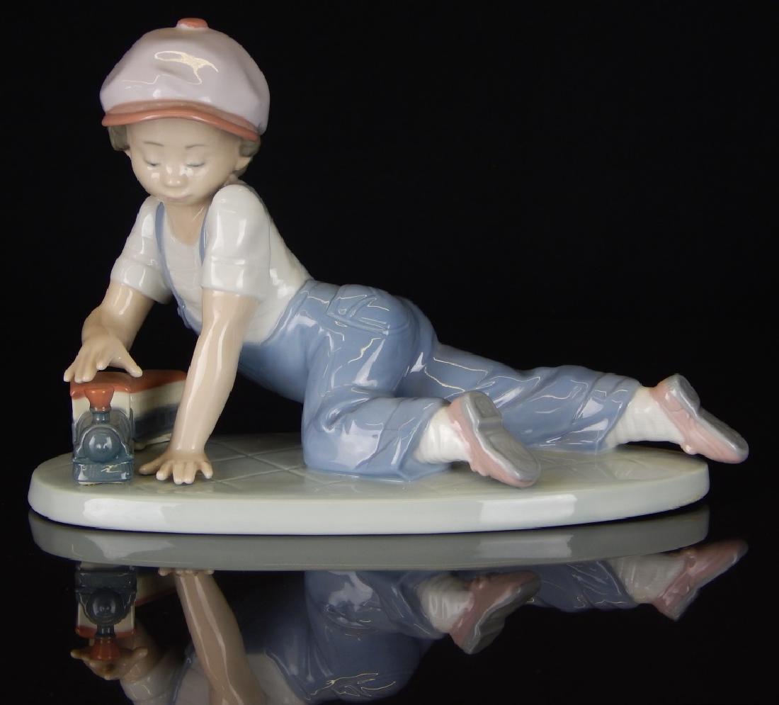 LLADRO #7619 BOY WITH TRAIN PORCELAIN FIGURE (1 of 3)