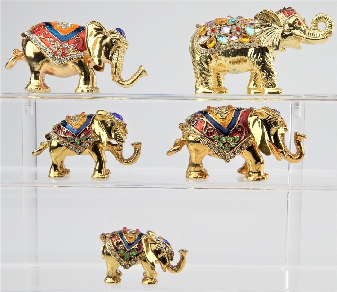 5 ENAMEL JEWELED ELEPHANT TRINKET BOXES: A lot of 5 Jay Strongwater style figural trinket boxes depicting standing elephants. Each with enamel work and crystals. Tallest measures approx. 2 38" height.