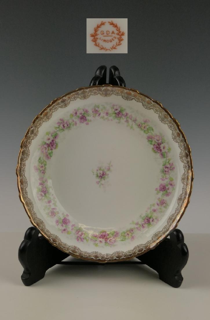 GDA LIMOGES FLORAL GOLD GILT FOOTED ROUND BOWL: Antique Gerard, Dufraisseix & Abbot Limoges French porcelain round and footed dish bowl having a hand painted floral wreath design with gilt pattern accent rim. Exterior with raised embossed design. B