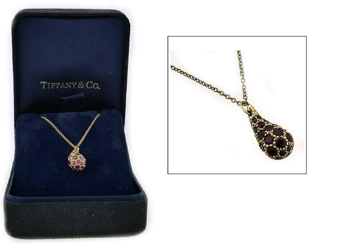 18K TIFFANY & CO PERETTI PAVE RUBY TEAR DROP PEND: Exquisite women's estate "Tear Drop" pendant and necklace set designed by Elsa Peretti for Tiffany & company crafted of 18k yellow gold. Pendant featuring glowing pave set round cut genuine rubies. Pe