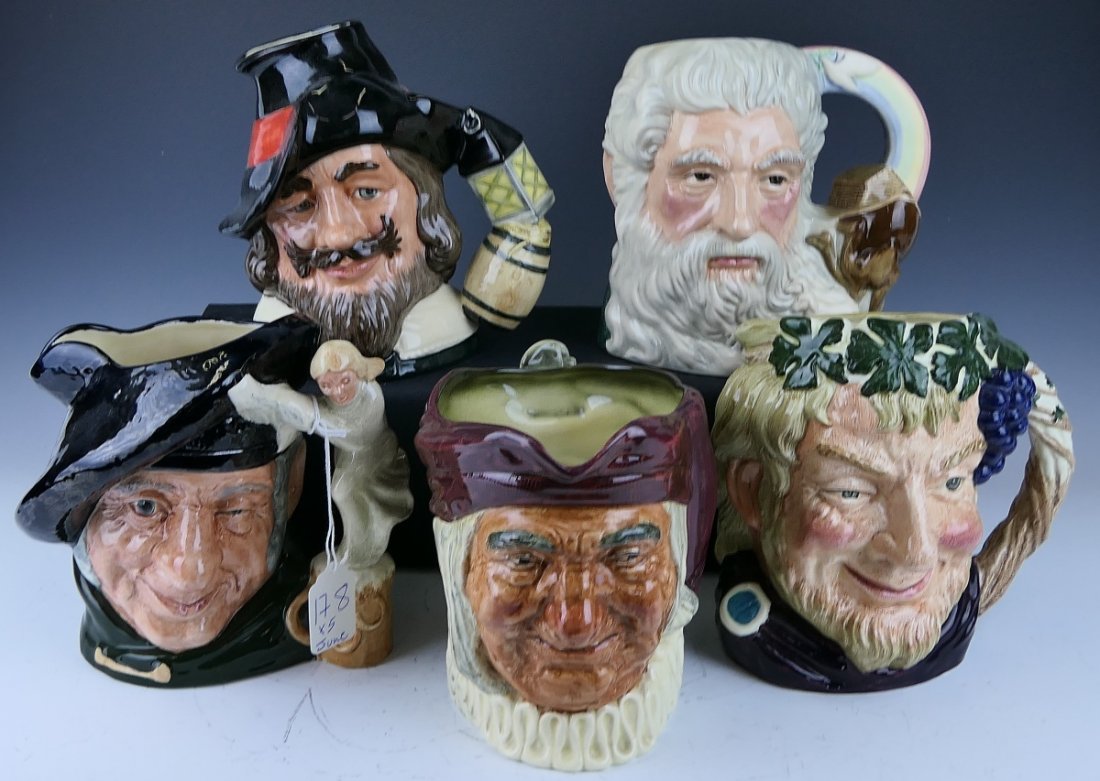 (5) ROYAL DOULTON PORCELAIN CHARACTER JUGS: A lot of 5 Royal Doulton Character mug / jugs to include "Tam O'Shanter" D6632, "Simon The Cellarer". "Guy Fawkes" D6861, "Bacchus" D6499 and "Noah" D7165. Tallest measures approx. 7 1/4" height.