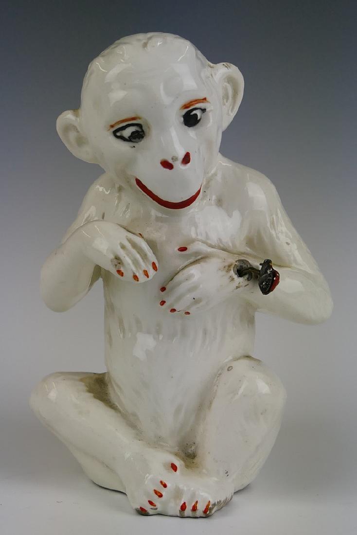 ANTIQUE CZECH WHITE PORCELAIN MONKEY w LADY BUG: Adorable antique Czechoslovakian glazed white porcelain sculpture depicting a seated monkey entertained by a lady bug on his wrist. Completed with red and black accenting. Marked to bottom. Measuresap