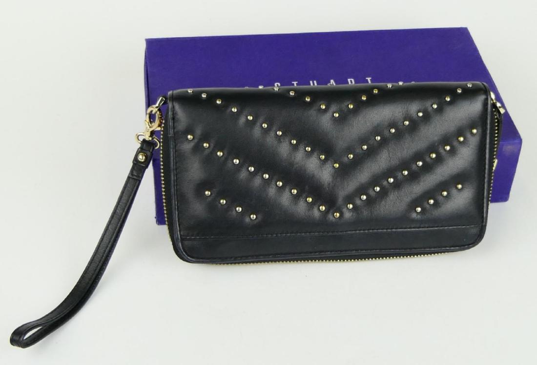 STUART WEITZMAN BLACK LEATHER STUDDED PURSE w BOX: Stuart Weitzman black leather clutch purse having a chevron silver tone metal bead studded design. Includes dust cover pouch and presentation box. Measures approx. 8" length x 4 1/4" height x 1 1/4" d
