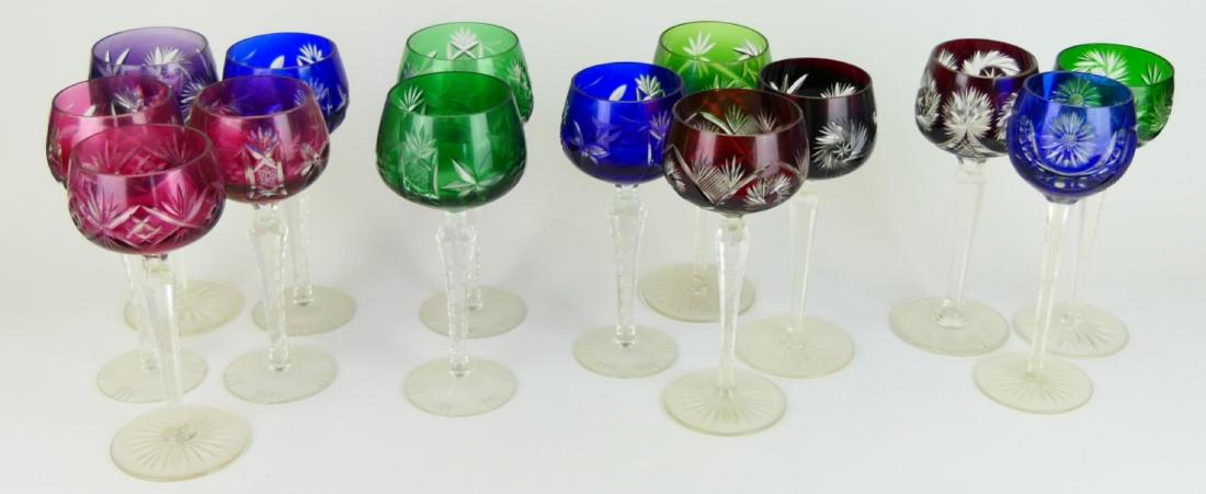 14 BOHEMIAN CUT TO CLEAR WINE CHAMPAGNE GLASSES: A collection of 14 Bohemia Czech cut to clear art glass champagne / wine stemware glasses. Includes ruby, cranberry, emerald, amethyst and cobalt colors. Some with slightly differing shapes and sizes.