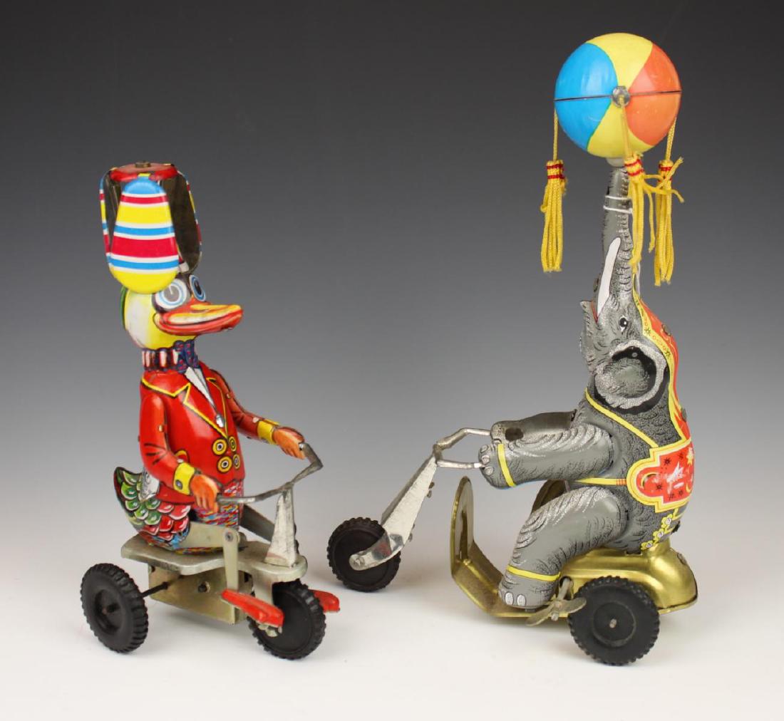 TWO VINTAGE METAL CIRCUS WIND UP TOYS: Two vintage metal circus wind up toys made in China. Largest measures 10 1/2" height.