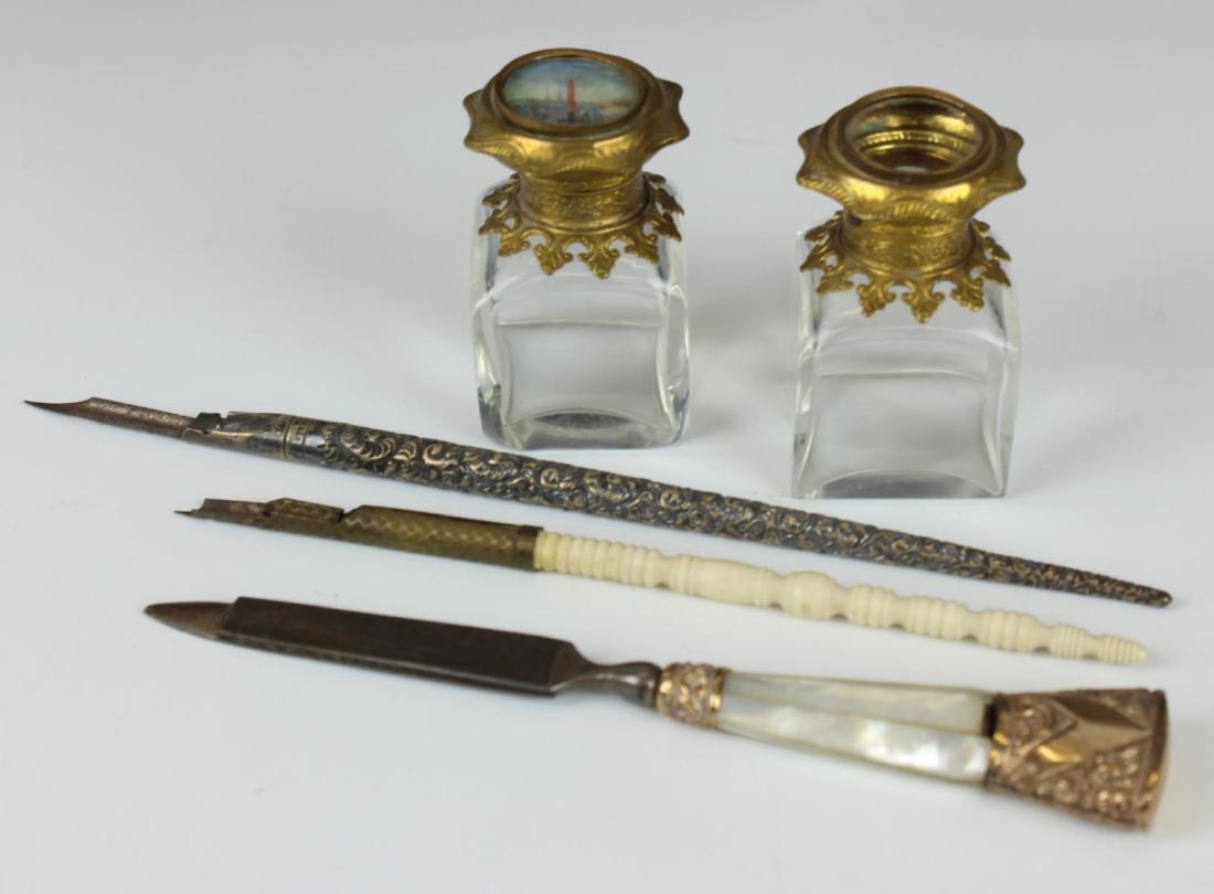 5 pc ANTIQUE FRENCH INK WELLS & PENS: Antique witting set including two ink wells (2 1/2" H) , one with a hand painted miniature to top and two pens, one sterling (7 1/2" L) and the other is carved bone (6 1/4" L). There id a file/letter 