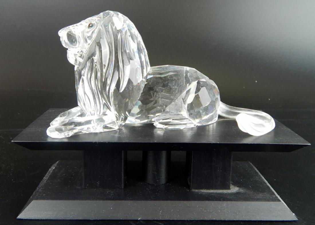 SWAROVSKI CRYSTAL 1995 SOCIETY "LION" FIGURE: Swarovski Austrian crystal 1995 Collector's Club "Lion" sculpture from the "Inspiration Africa" collection. Bears Swan mark to bottom. Includes wooden stand. Measures approx. 4 1/2" height (11.4cm) ov
