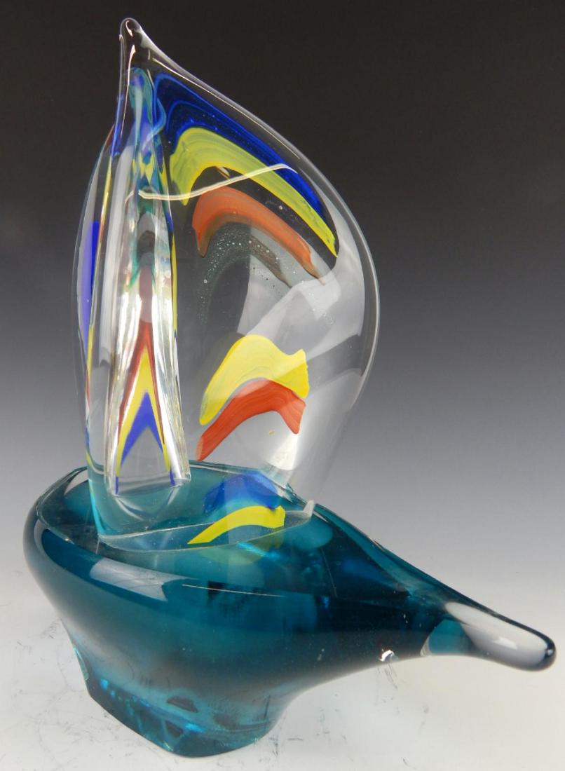 POLISH HAND BLOWN ART GLASS SAILBOAT SIGNED: A wonderful vintage hand blown Polish art glass sailboat with aqua glass hull and clear to brown, yellow and cobalt blue sails. Etched signature to bottom. Retains Carpathian Art Glass label to side.