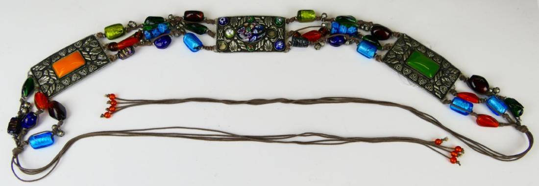 VINTAGE SILVER PLATE & MURANO GLASS BEADED BELT: A vintage women's estate belt crafted of brown rope with Murano Italian art glass beads and large silver plated panels. Belt measures approx. 66 1/2" long open end to end (168.9cm). Approx. 2" width (