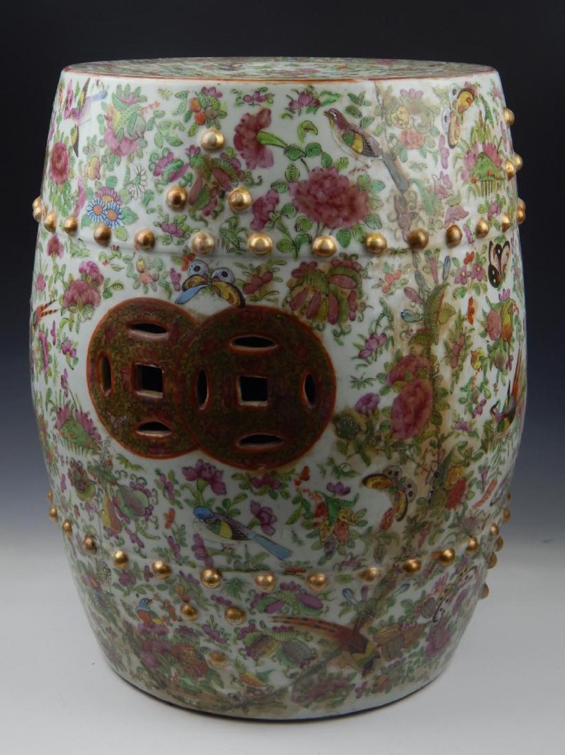 CHINESE ROSE MEDALLION PORCELAIN GARDEN SEAT: Chinese hand painted Rose Medallion porcelain garden seat depicting birds and butterflies amongst floral blooms with branches. Measures approx. 18" height x 14" diameter (45.7cm x 35.6cm).