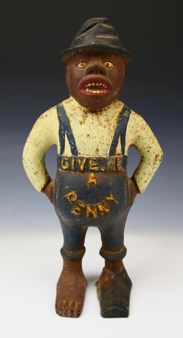 ANTIQUE CAST IRON BLACK AMERICANA BANK: Black Americana "Give me a penny" cast iron antique blank. Measures approx 11 1/2" height.