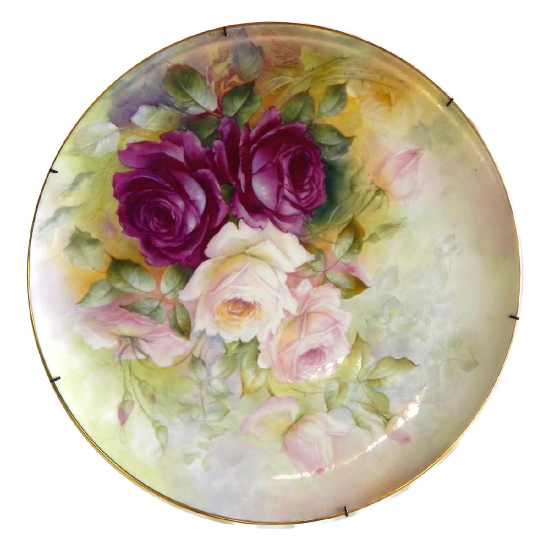 T&V LIMOGES PORCELAIN FLORAL 16" CHARGER SIGNED: Antique Tressemann and Vogt Limoges French hand painted floral round charger. Signed "L. G. Norrell". Measures approx. 16" diameter (40.6cm).