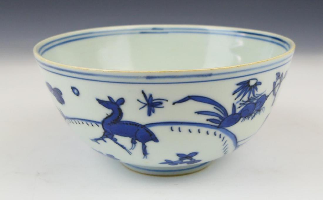 CHINESE MING PERIOD BLUE & WHITE PORCELAIN BOWL: Antique Chinese Ming Dynasty period hand painted blue and white porcelain bowl having a landscape scene with deer, flowers and birds. Interior showing a floral design. Bottom holds Fu Gui Jia Qi mark.