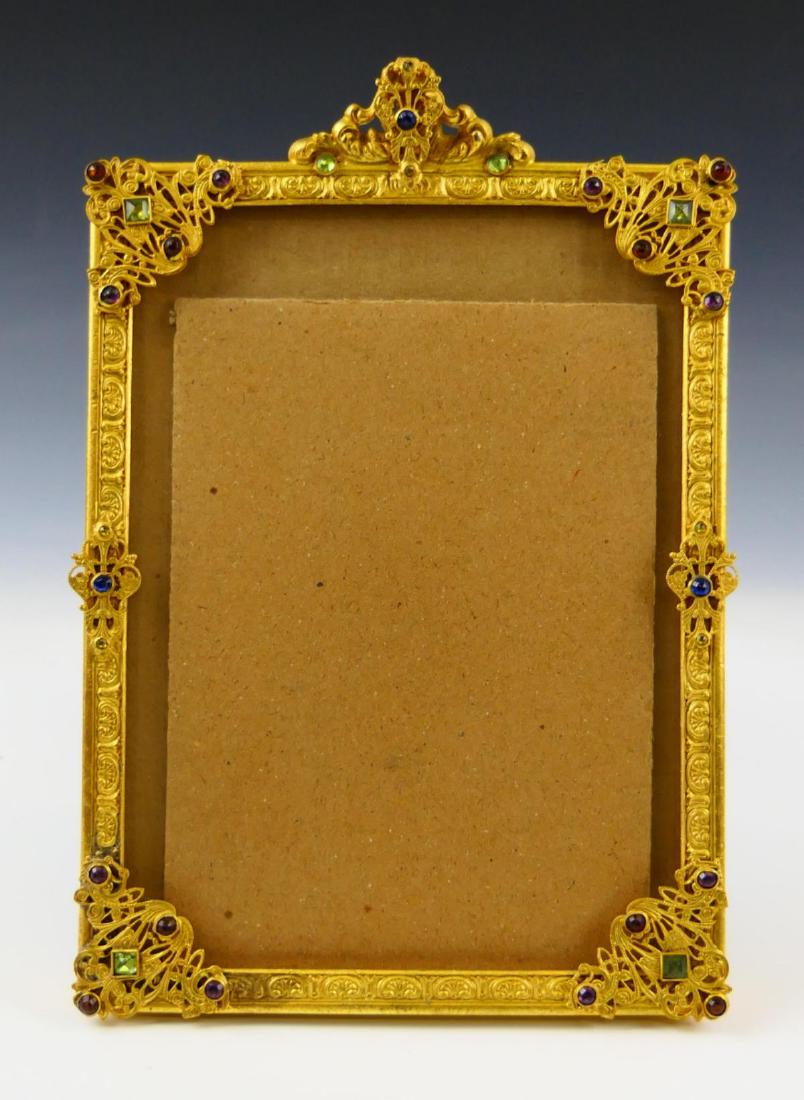 1920's APOLLO STUDIOS GILT METAL JEWELED FRAME: Circa 1920's - 1930's, Apollo Studios ornate gilt metal picture frame jeweled with multi-color rhinestones. Measures approx. 9 1/2" height x 6 1/2" width (24.1cm x 16.5cm).
