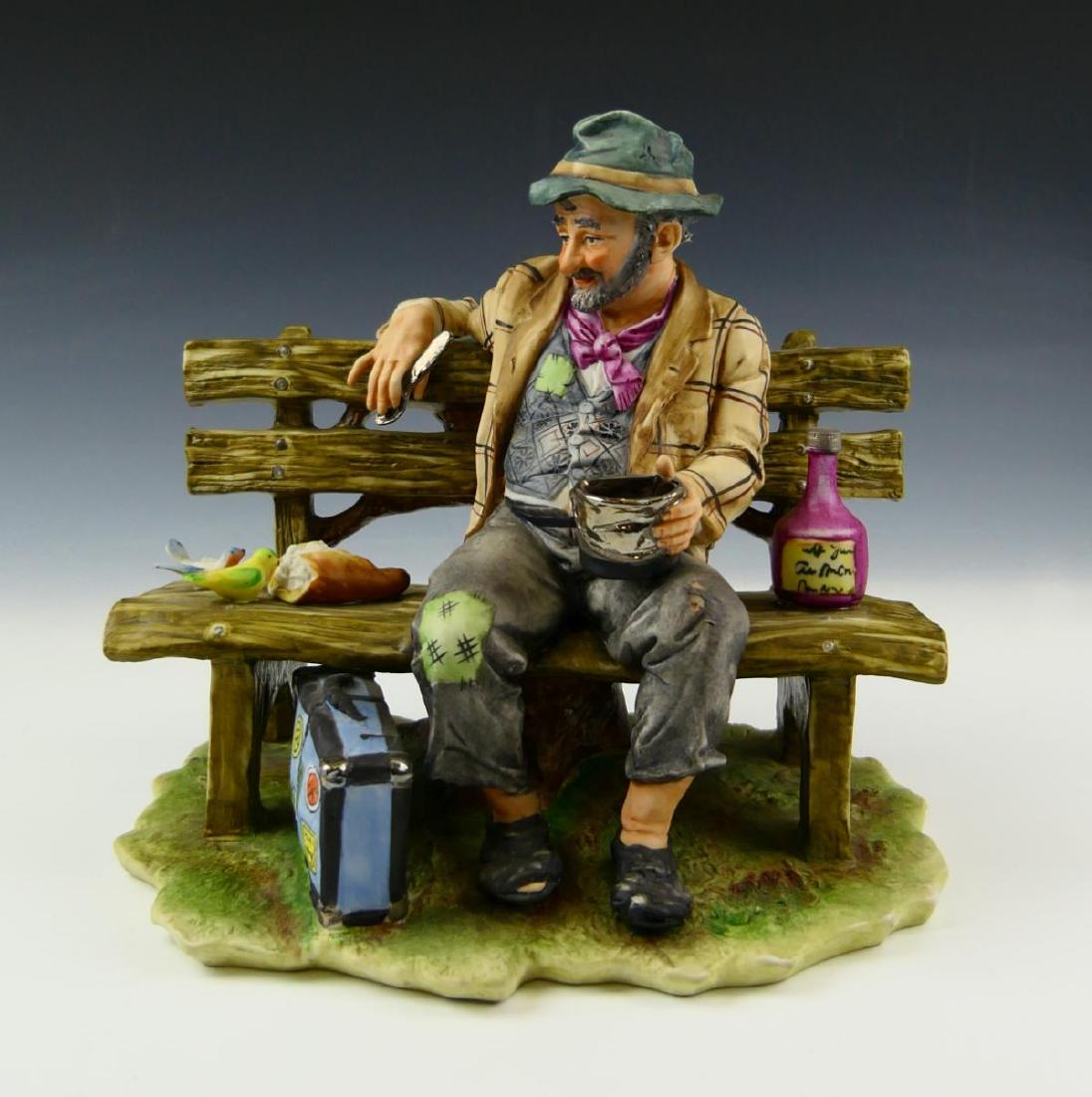 CAPODIMONTE VINTAGE "WINO" PORCELAIN FIGURE: CAPODIMONTE VINTAGE "WINO" PORCELAIN FIGURE, measures 9" length.