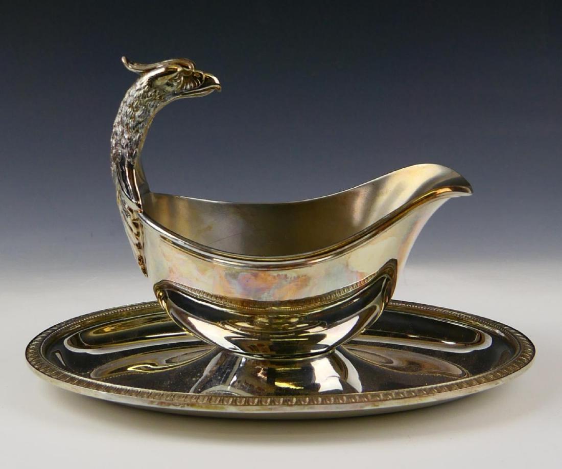 CHRISTOFLE "MALMAISON-BEAUHARNAIS" GRAVY BOAT: Christofle France silver plated gravy boat with under plate in the "Malmaison-Beauharnais" pattern having a figural bird head design to handle with stylized leaf pattern rim. Fully hallmarked. Measure