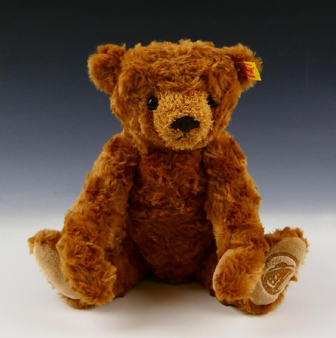 VINTAGE STEIFF MOHAIR JOINTED TEDDY BEAR: Measures about 9" seated, jointed legs and arms, bears button and ribbon in ear, very good condition.
