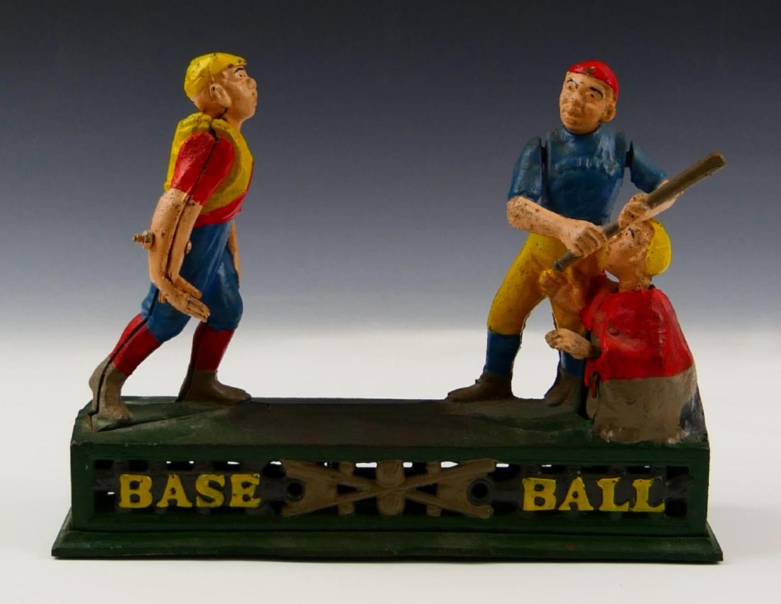 VINTAGE CAST IRON TOY BASEBALL BANK: Vintage cast iron toy bank, made in Taiwan. Measures 9 1/2" width by 7 1/2" height.