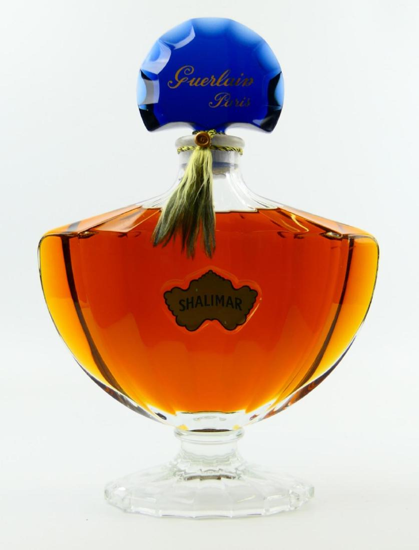 SHALIMAR BY GUERLAIN FACTICE PERFUME BOTTLE: Shalimar by Guerlain factice perfume bottle. Measures approx. 15" height x 11" width (38.1cm x 27.9cm).