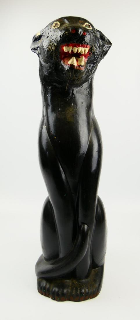 LARGE CERAMIC BLACK PANTHER SCULPTURES: A large ceramic black panther depicted in a seated position. Measures approx. 27" height (68.6cm).