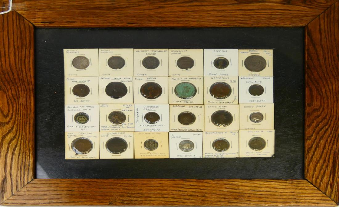 24 ANCIENT COINS MOUNTED IN DOUBLE SIDED FRAME: A collection of 24 ancient coins mounted in a double sided display frame. Coins are to include 2 ancient Mongolia silver coins, 2 ancient Trebazonde Empire silver coins, Septimus Roman silver coin, 59