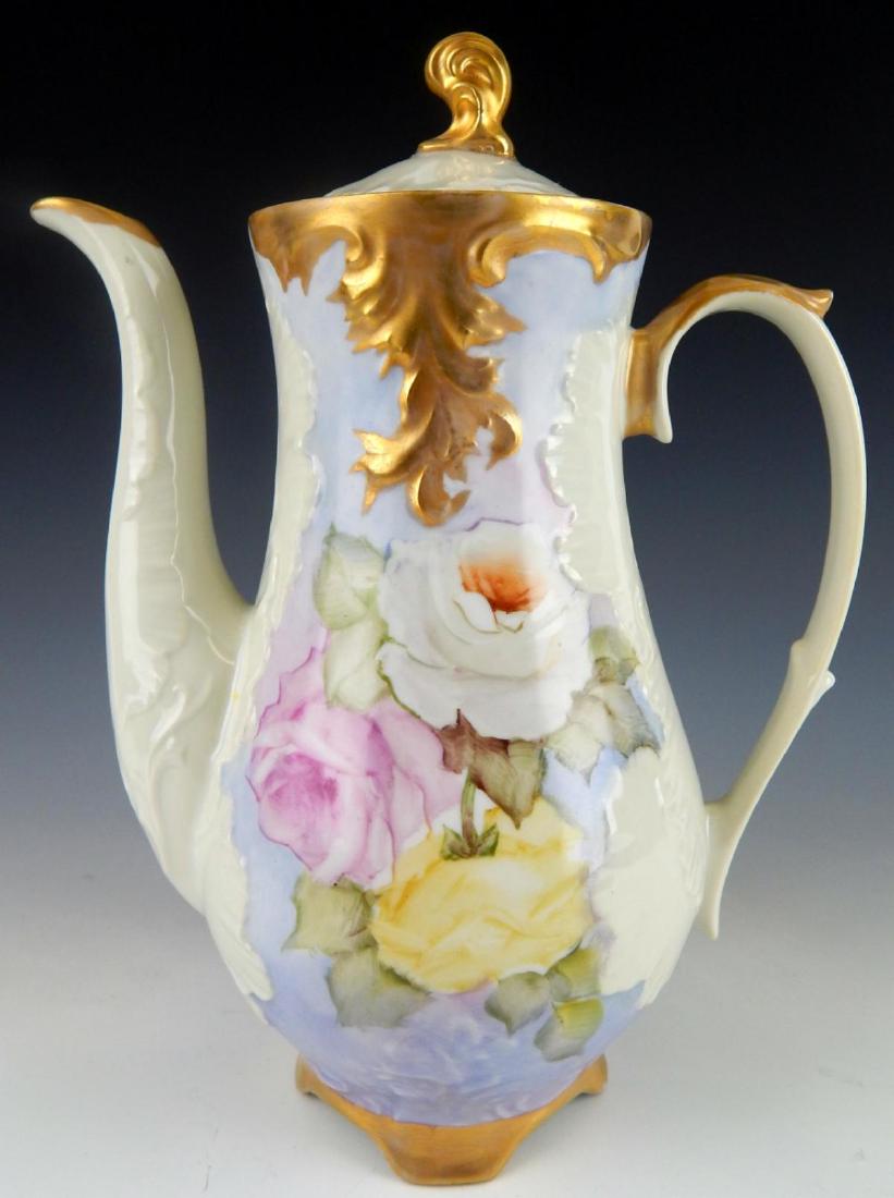 ANTIQUE LIMOGES HAND PAINTED FLORAL CHOCOLATE POT: Antique, probably turn of the century, hand painted Limoges French porcelain coffee / chocolate pot having a floral design over a sky blue ground with 24k yellow gold accent work. Signed to bottom. Me