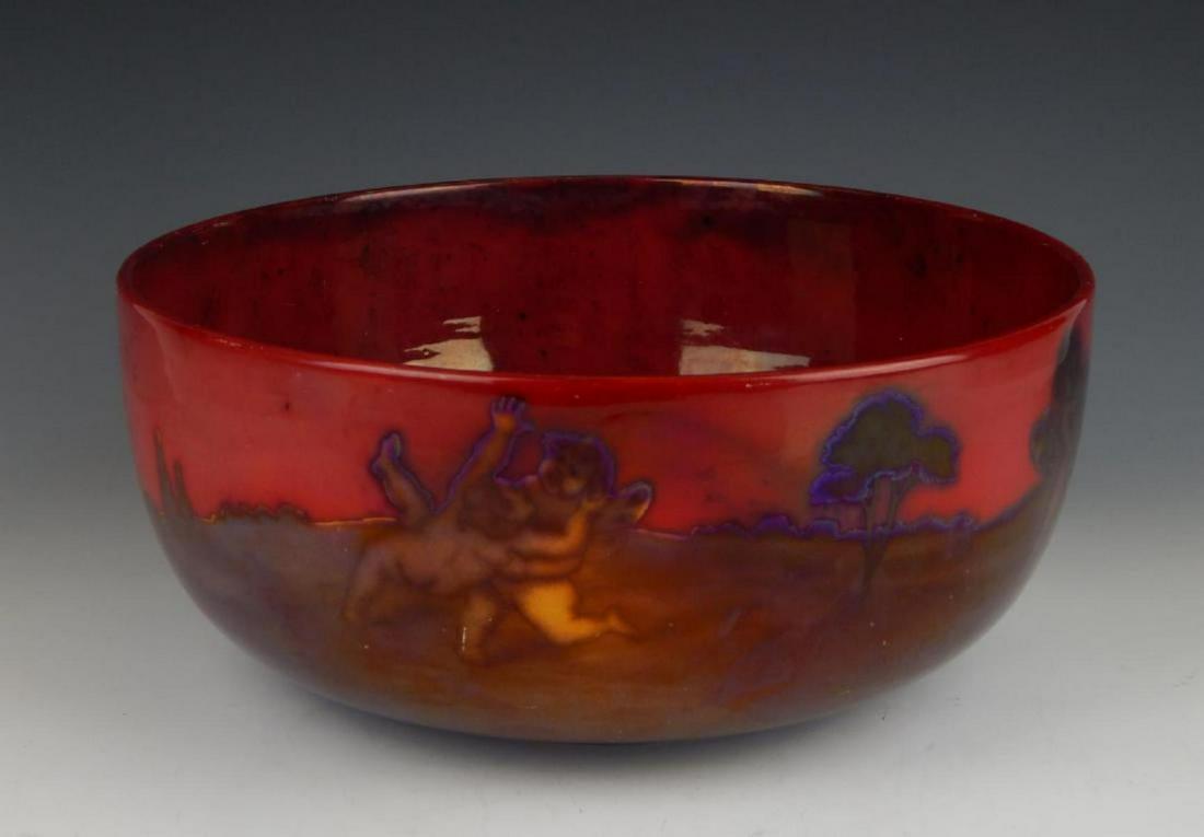 1900's ZSOLNAY PECS LUSTER EOSIN GLAZE CENTER BOWL: Antique Zsolnay Pecs Hungarian red original Eosin glazed luster ware pottery bowl depicting winged cherubs in landscape scene to exterior and interior features men with nude females, cherub and horse.