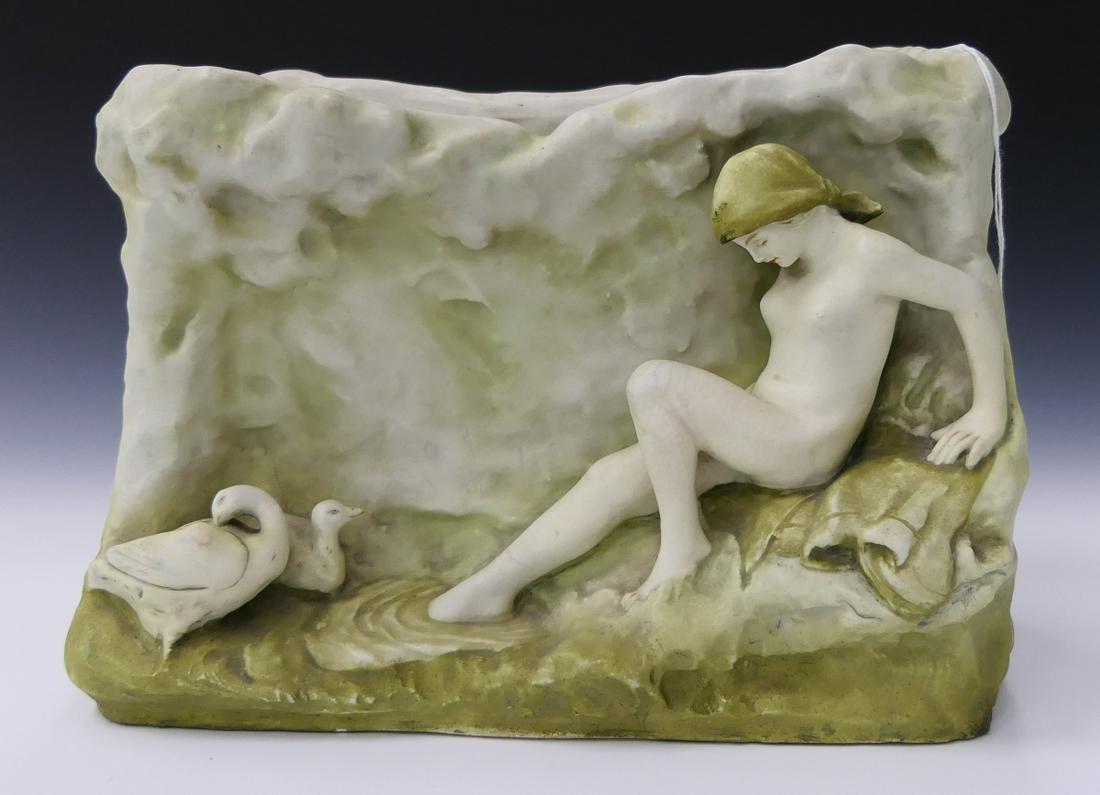 ART NOUVEAU AMPHORA WOMAN WITH DUCKS PLANTER: Antique Amphora Art Nouveau rectangular vase having a figural design depicting a nude female with ducks. Bottom with impressed marks and numbered 4849 10 G. Measures approx. 8 1/2" height x 11 3/4 x 6