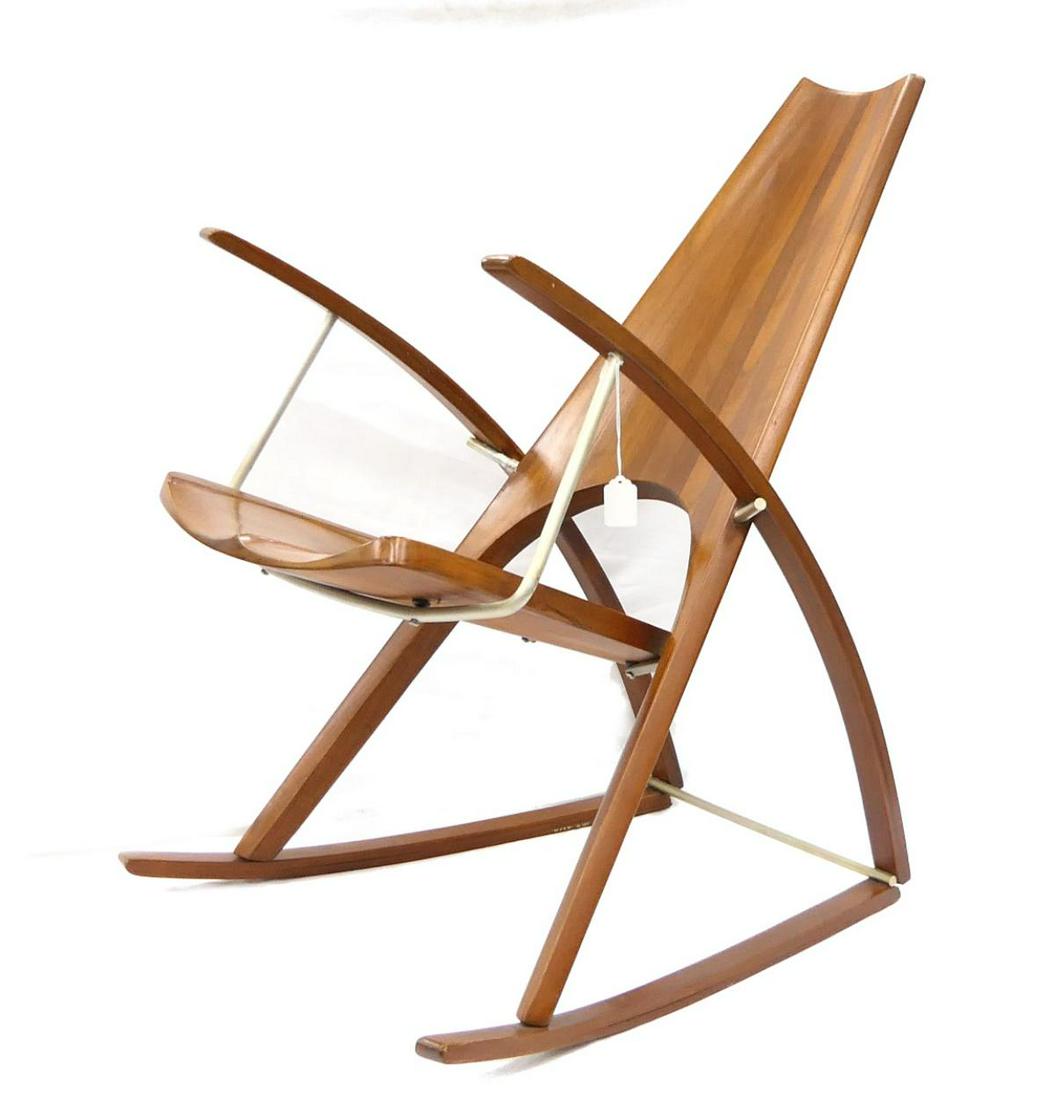RARE MID MODERN LEON MAYER ROCKING CHAIR: Property of a Palm Beach Lady. Signed in 2 places . By the Leon Mayer studio, executed in 1970 in solid walnut. 39" x 19.75" x 24". Third party shipping required