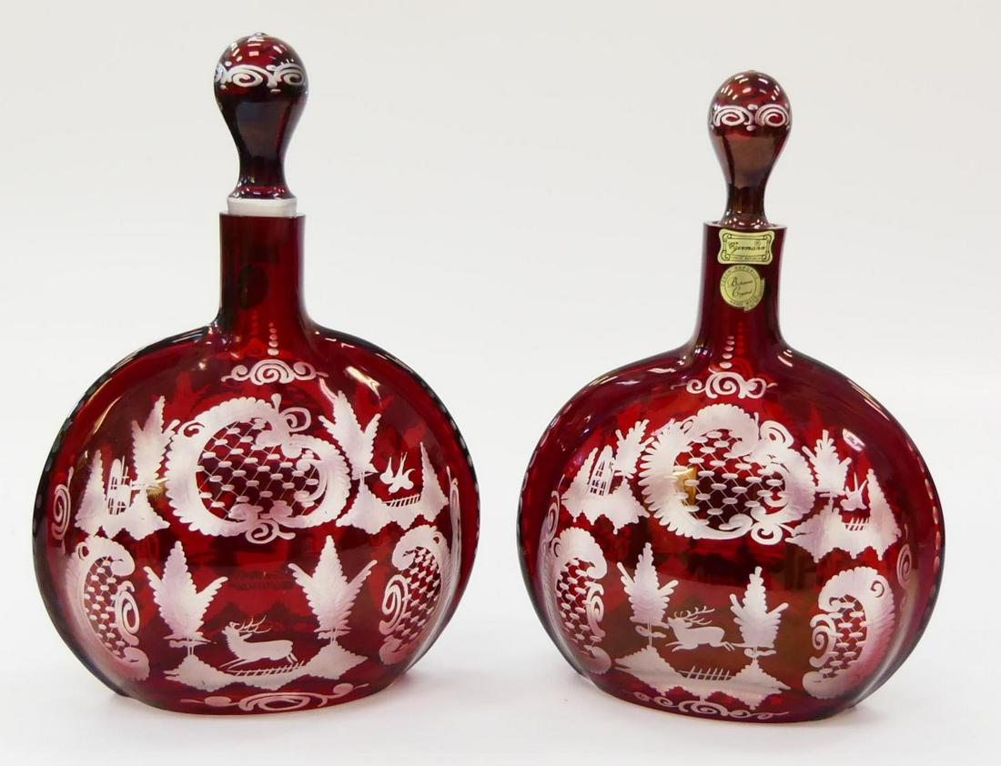 PAIR CZECH CRANBERRY CUT TO CLEAR DECANTERS: PAIR CZECH CRANBERRY CUT TO CLEAR DECANTERS. Each measures approx. 9 7/8" height x 7" width (25cm x 17.8cm) overall including stoppers.