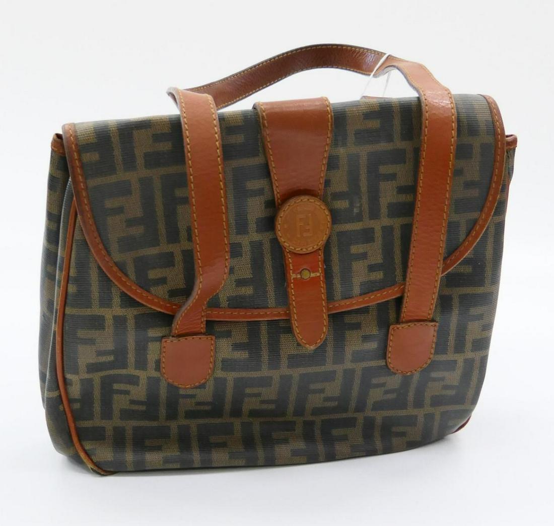 FENDI VINTAGE LEATHER MONOGRAMMED SHOULDER BAG: Measures 12" wide and 9" high. Property of a Palm Beach lady. In good condition. This bag was purchased in Italy worn home and never worn again. third party shipping required