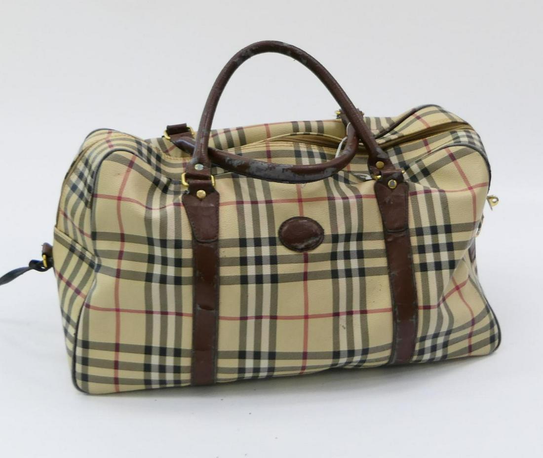LARGE BURBERRY CANVAS CARRY ALL: Well loved, the bag itself is in good condition, the leaher handles are rubbed, and there are a few stains to inside. This was property of a Palm Beach lady, and still has a lot of life left. Measures