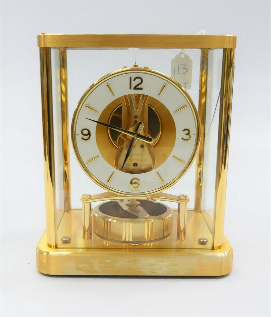 JEAGER LECOULTRE ATMOS BRASS CASE MANTEL CLOCK: Jaeger LeCoultre Swiss Atmos clock with gilt brass case and glass screens. Equipped with 13 Jewel Caliber 540 movement. Measures approx. 9" height x 7 3/4" width x 6" depth (22.8cm x 19.7cm x 15.2cm).