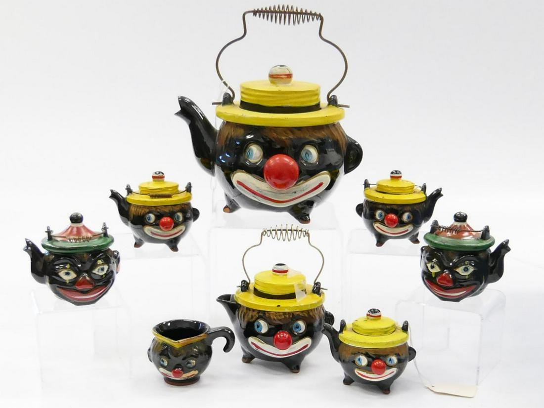 8 Vtg BLACK AMERICANA PORCELAIN TABLEWARE ITEMS: A lot of 8 vintage Japanese porcelain Black Americana tableware items having a figural Sambo head design to include teapot, covered creamer, open creamer and 5 salt & pepper shakers. Teapot is tallest
