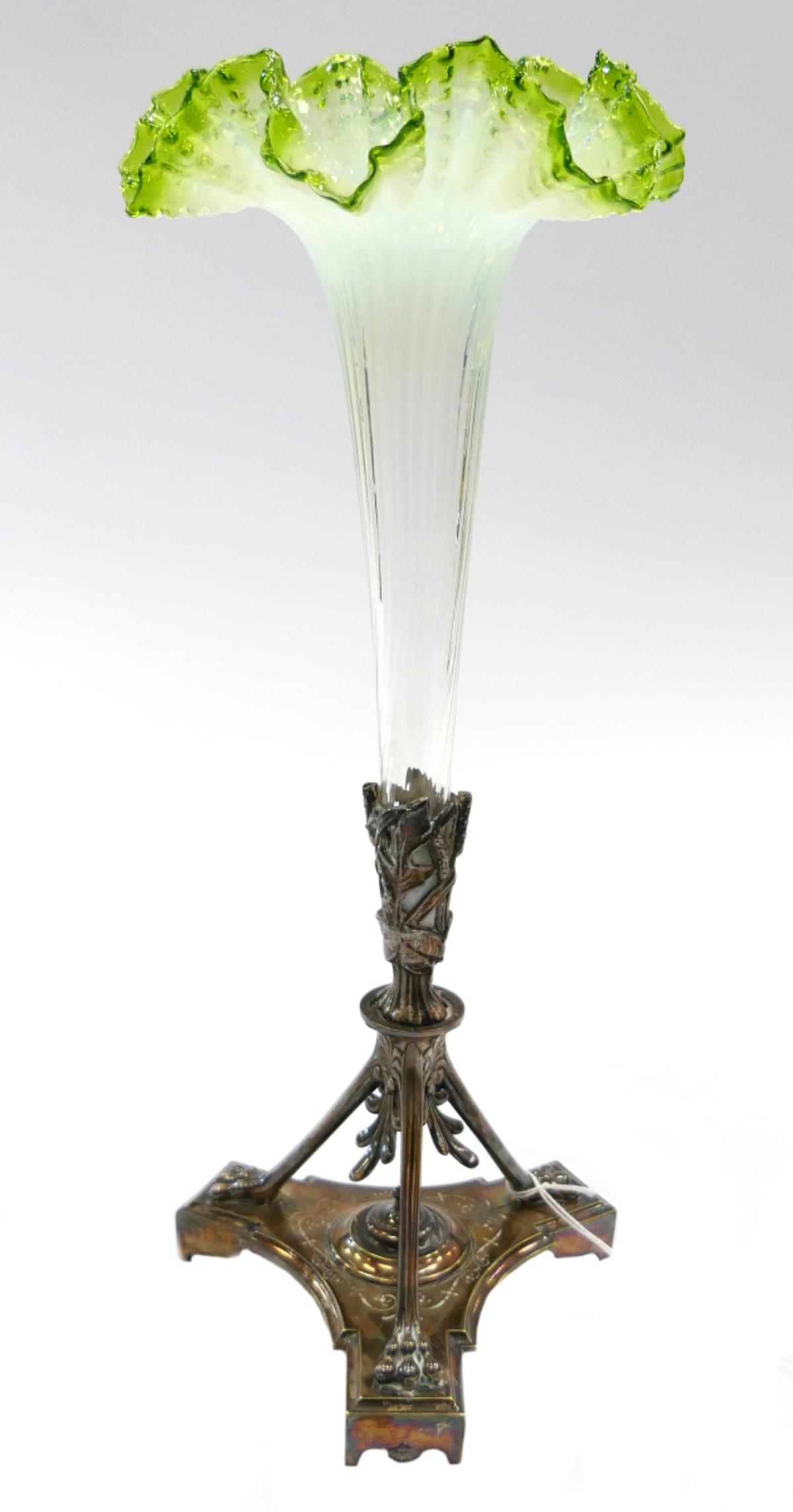 EXTRAORDINARY CHRISTOPHLE ANTIQUE EPERGNE: Triple footed silver plated turn of the century signed Christophle epergne base. The base measures 7" tall. Now in the epergne sits a slightly later gorgeous Vaseline glass flute. The flute measures 1