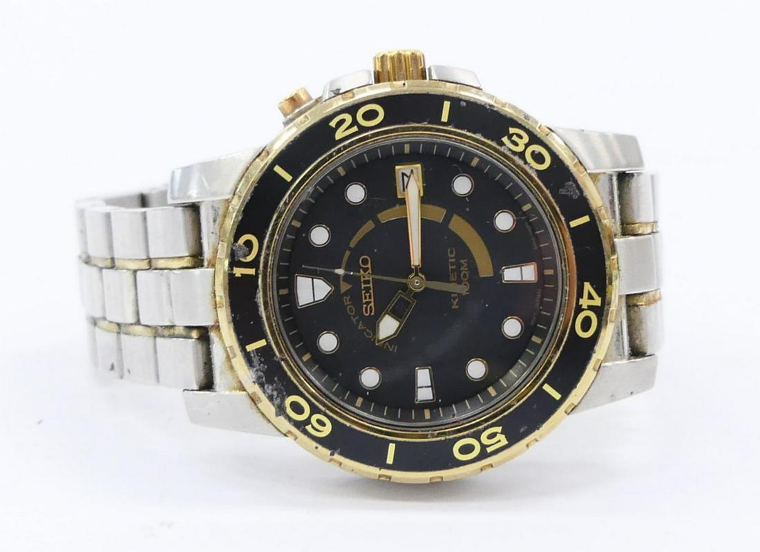 SEIKO GENTS SPORT WATCH: Black face with gold plated bezel. Great looking stainless steel watch. Third party shipping required