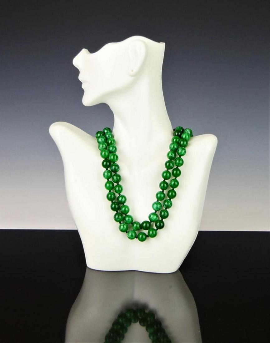 32" JADITE BEADED NECKLACE: 32" JADITE BEADED NECKLACE, each bead hand knotted between each other, clasp is gold plated. Each bead is approx 8mm. All beads tested as Jadeite.