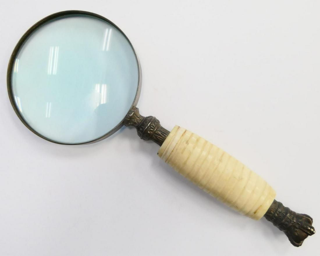 VINTAGE BONE HANDLE MAGNIFYING GLASS: A vintage magnifying glass having a bone handle and crown end design. Measures approx. 10 1/4" length x 4" width (26cm x 10.1cm).