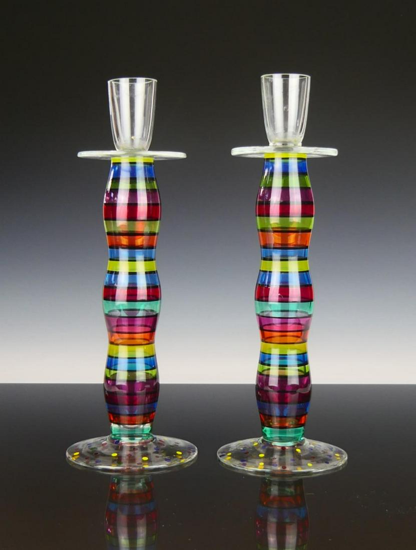 PAIR OF TALL COLORFUL MURANO CANDLESTICKS: Each measures 12' tall. Multi colored bands seperated wit black lines. Colorful dots to base. Very good condition third party shipping is required